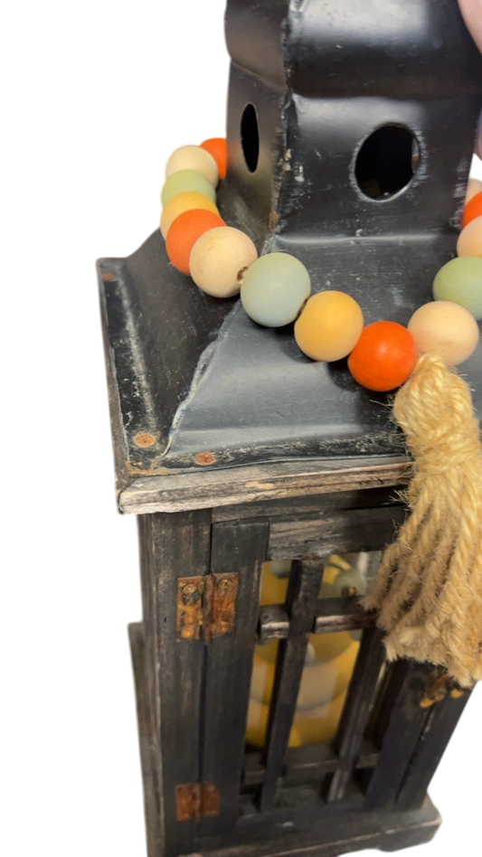 Decorative Item Lantern, beads, and vase
